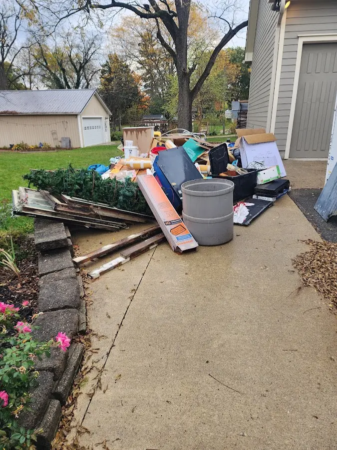 Dumpster being loaded with debris for 3 Yard Dumpster Rental in Keizer